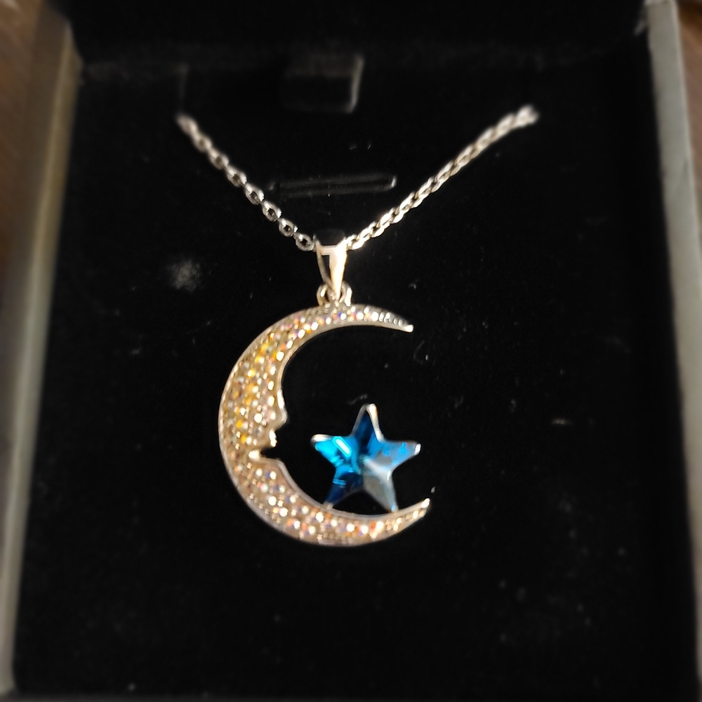 Moon and star crystal necklace 
Label says crystal
